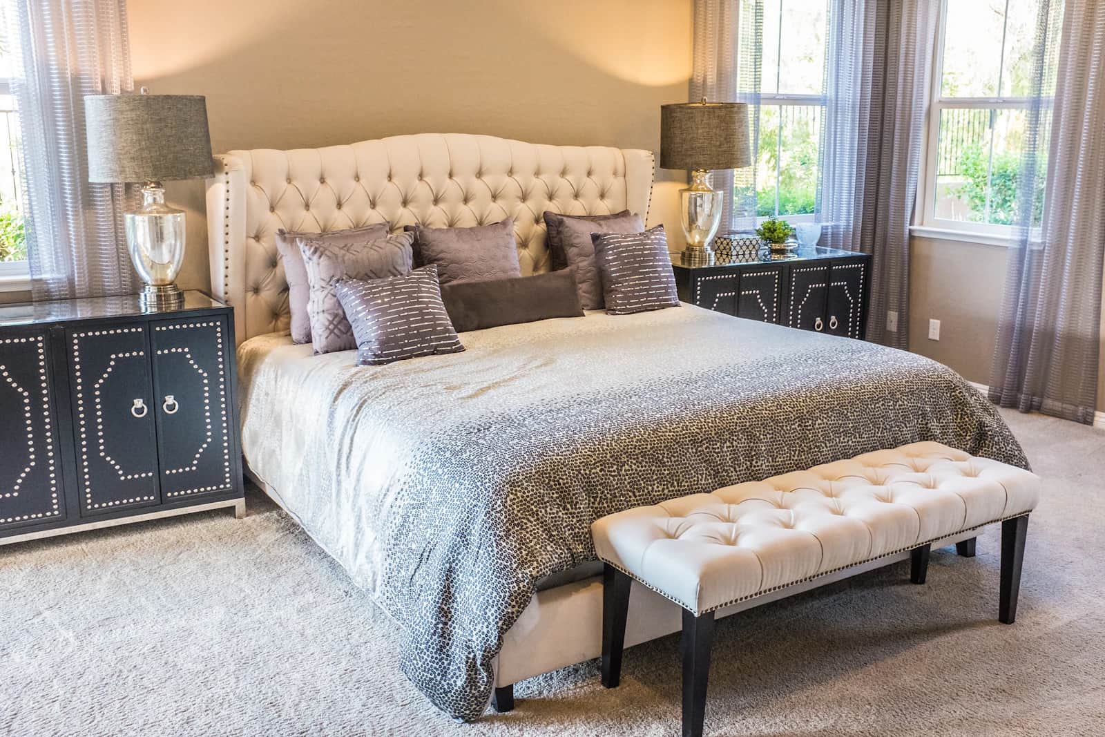 Neatly presented guest bedroom with made bed and clear surfaces